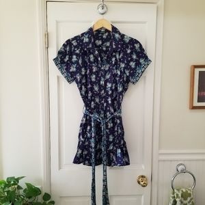 Really cute top with belt and accent pockets